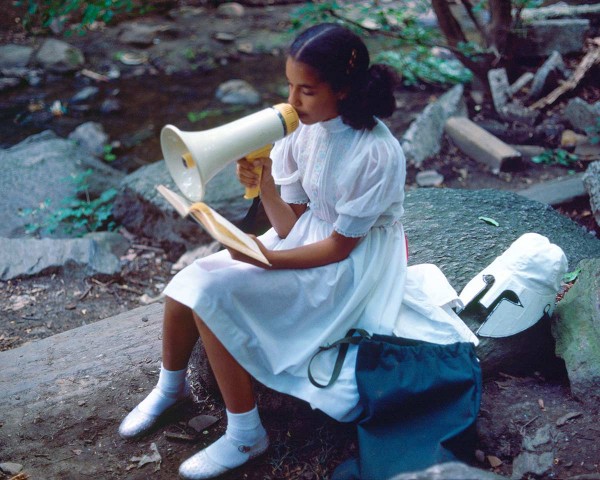 The Little Girl with Pink Sash memorizes her Latin lesson, performance Rivers First Draft by Lorraine O’Grady.