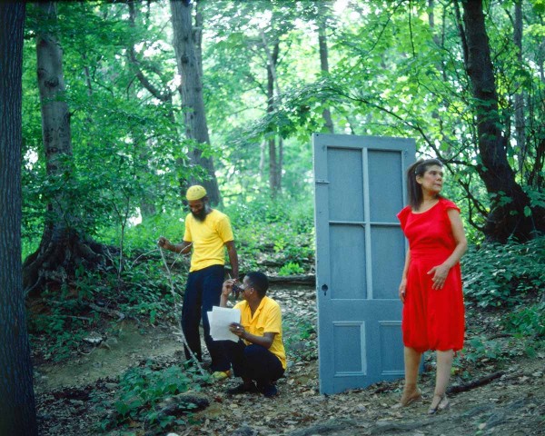 The Woman in Red hesitates outside after the Black Male Artists in Yellow eject her, performance Rivers First Draft by Lorraine O’Grady.